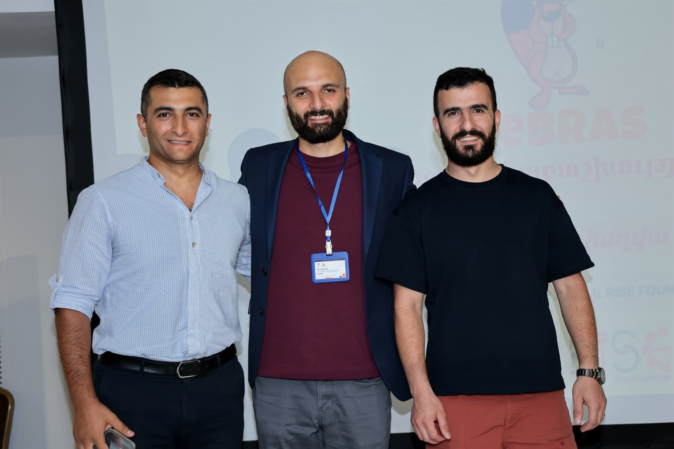 The three trustees of RISE Educational Foundation standing together at the Bebras award ceremony: Garnik Gevorgyan, David Khachatryan and Andranik Avetisyan.